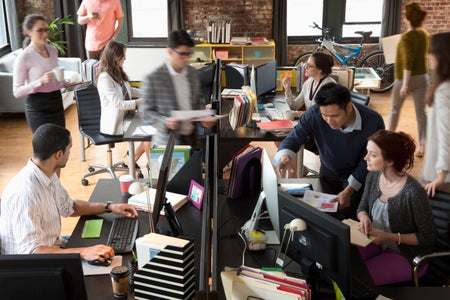 Busy office loft scene.