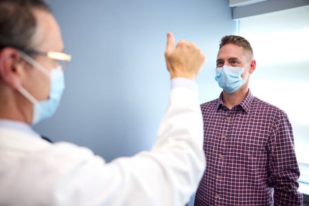 Tral coordinator  Eric McDade assesses participant Marty Reiswig for cognitive ability.