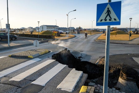 Image shows a crack cutting across the main road in Grindavik, southwestern Iceland following earthquakes.