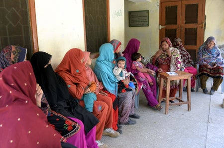 A Pakistani health worker speaks with pregnant Kashmiri women at a health care center in the village of Sharda in Pakistan's Neelum Valley.